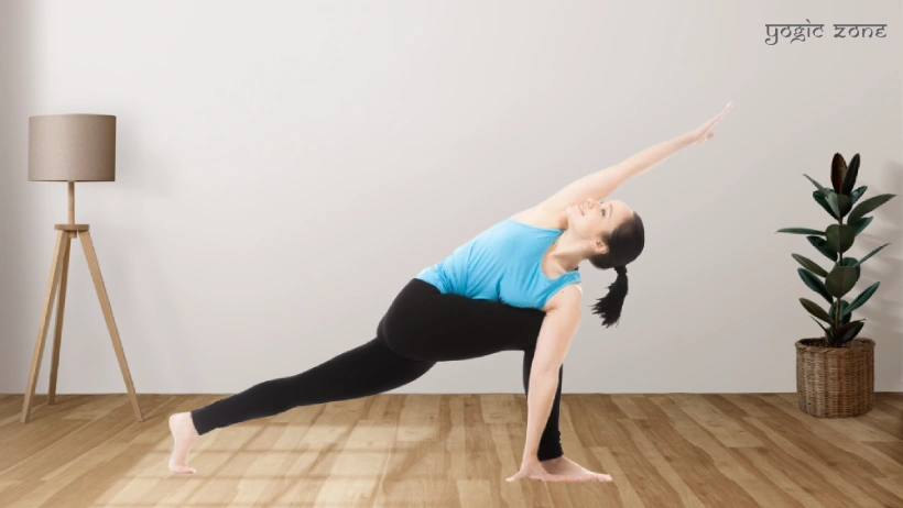 A lady practicing Utthita Trikonasana or Extended Triangle Pose for her Ashtanga yoga for beginners routine