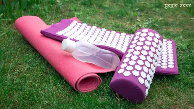 Yoga mats on the grass. Blog on What to Look for in a Yoga Mat by staging.yogiczone.com